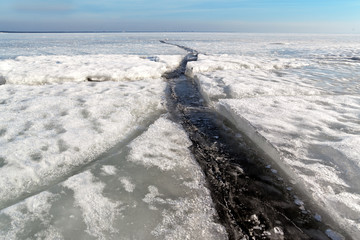 Ice crack. Concept of collapsing relationships between people