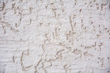 Background image of Stucco wall with hand-made decorative plaster. Texture of gray decorative plaster or concrete. Copyspace for design.