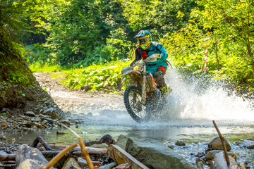 Enduro Racing in the Summer Sunny Forest and Spray © goodman_ekim