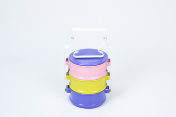 Metal Tiffin, Thai food carrier on white background in pastel colour, Thai style lunch box.
