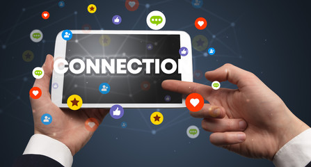 Close-up of a touchscreen with CONNECTION inscription, social networking concept