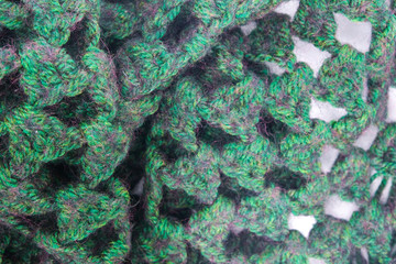 green knitted scarf texture background