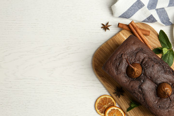 Flat lay composition with tasty pear bread on white wooden table, space for text. Homemade cake