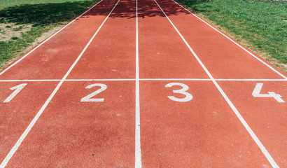 Fototapeta premium Close up on a start line of all weather surface running track