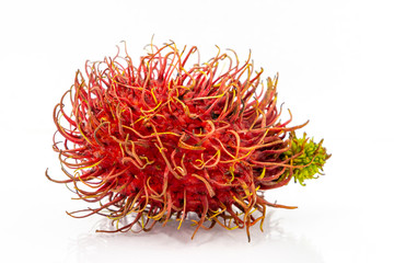 Fototapeta premium The fresh rambutan isolate with green leaf. Fresh Rambutan in bamboo basket on white background