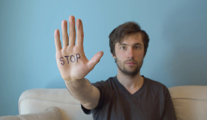 Naklejka premium Man with stop sign on the hand