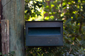  mailbox no number in front of the house with sunlight and beautiful natural background