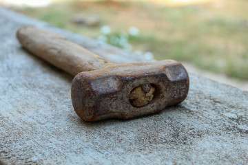 sledge hammer with the wooden handle