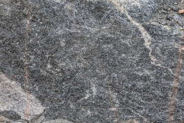 Close texture of the old stone. Grey detailed background