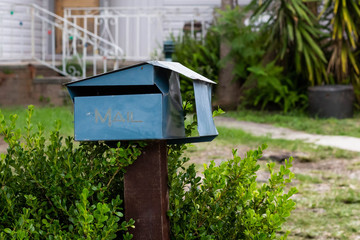  mailbox no number in front of the house with sunlight and beautiful natural background