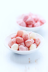 Colorful sweets on bright wooden background. Close up. 