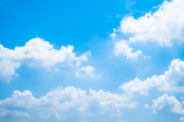 Fluffy white cloud in the blue sky.