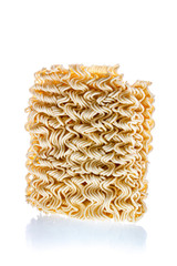 Dry uncooked instant noodles in rectangle shape isolated on white background. Unhealthy fast food or junk food concept.