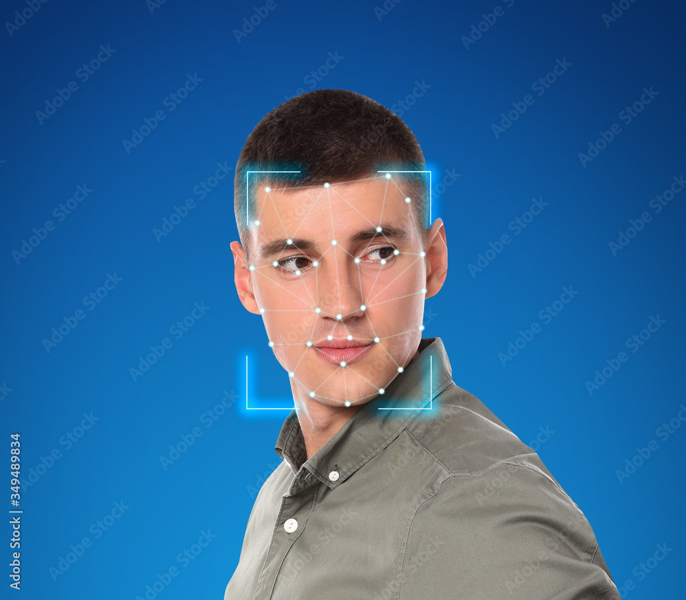 Poster facial recognition system. young man with scanner frame and digital biometric grid on blue backgroun
