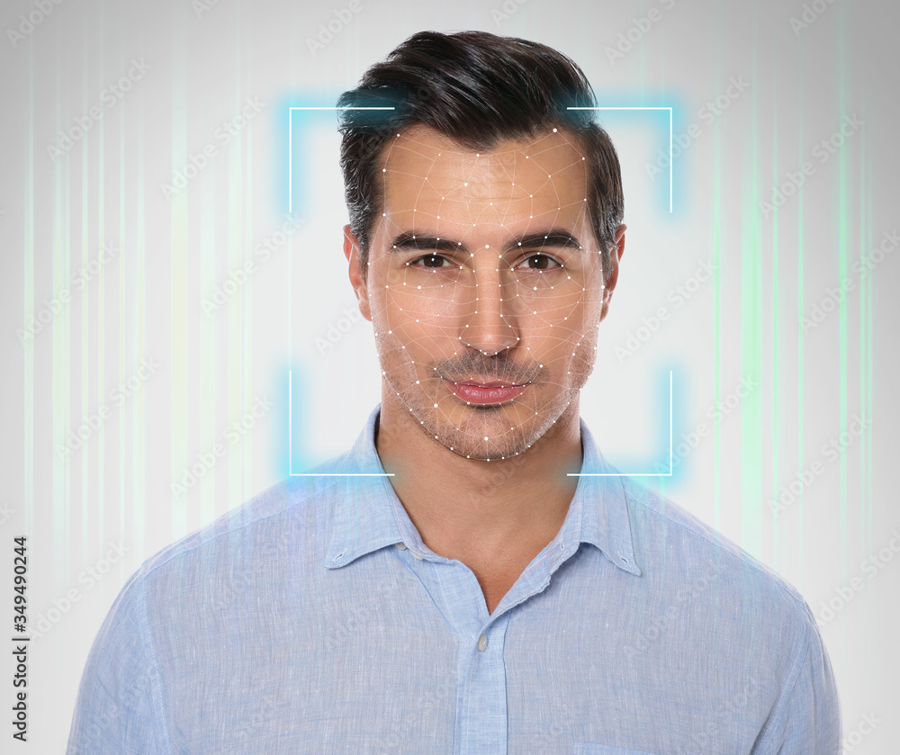 Poster facial recognition system. young man with scanner frame and digital biometric grid on light backgrou
