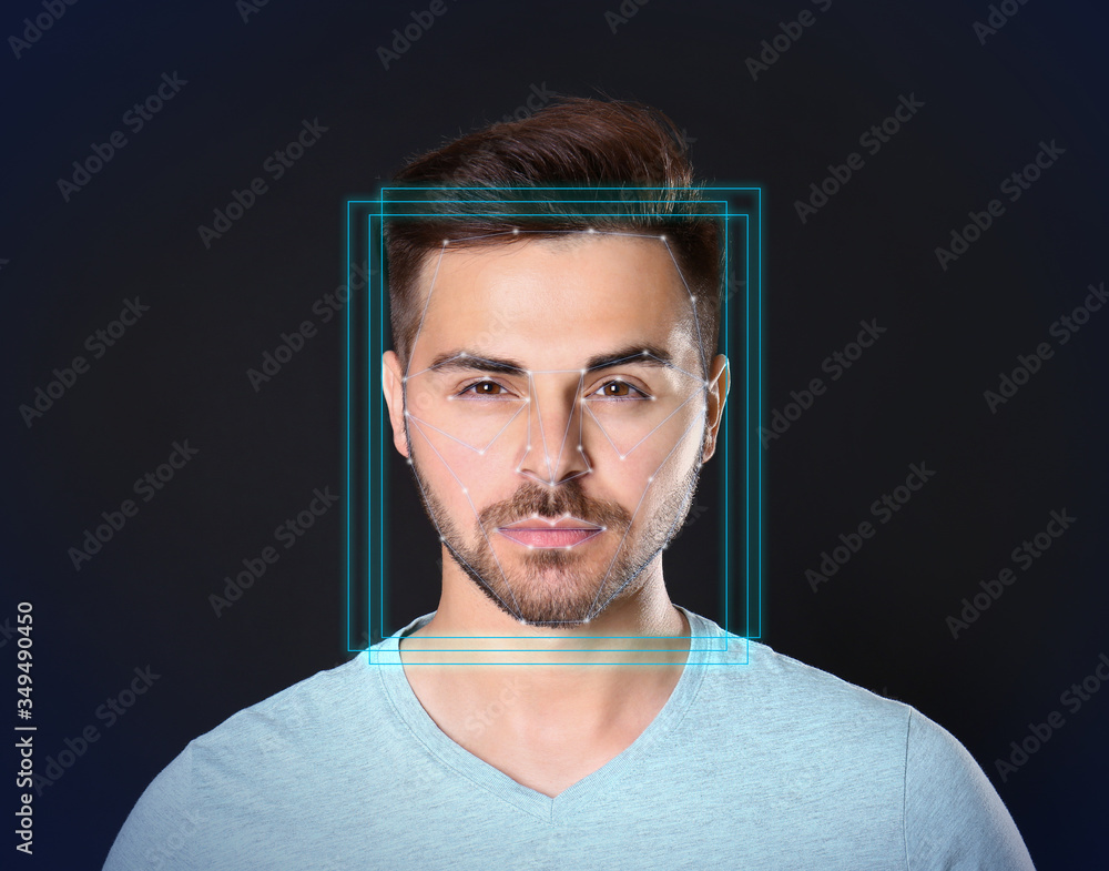 Poster facial recognition system. young man with scanner frame and digital biometric grid on dark backgroun