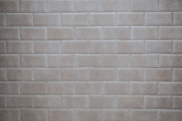 Beige tile on the wall. Background