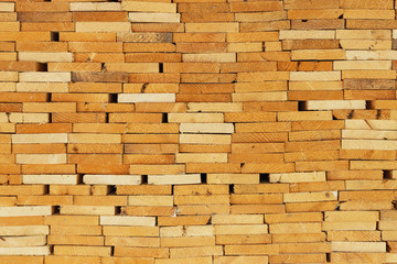 Precisely layered pile of wood from different cut firewood, heating material, sustainable reforestation