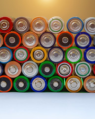 Closeup of saws of used alkaline batteries. Several in rows. Ecological pollution.