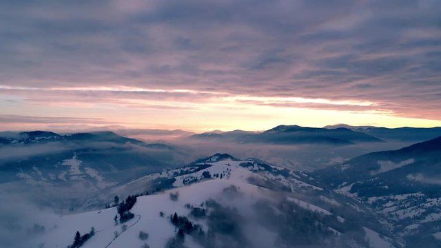 Fly over winter Carpatian mountains, beautiful landscape with a bird's eye view, UHD 4K