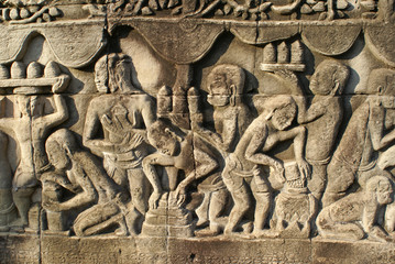 Khmer stone carving of men workers, Angkor Cambodia