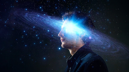 Dreamer, creative mind concept. A man with a galaxy in his head,