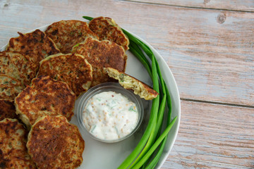 Potato pancakes with green onion and sauce