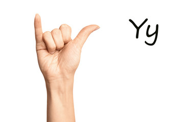 Woman showing letter Y on white background, closeup. Sign language