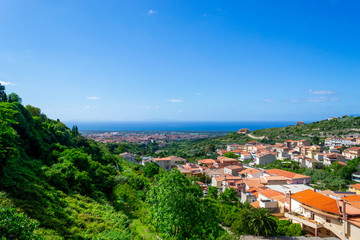 Fototapeta na wymiar Blue sky over a small town in Sardinia