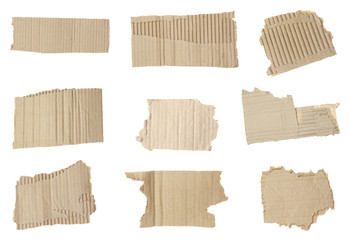 Set of torn cardboard pieces on white background