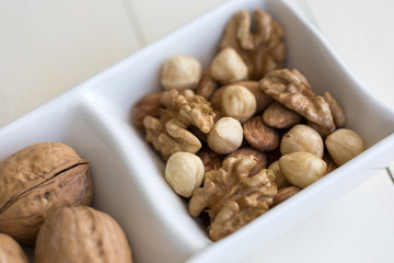 mixed nuts in white dish