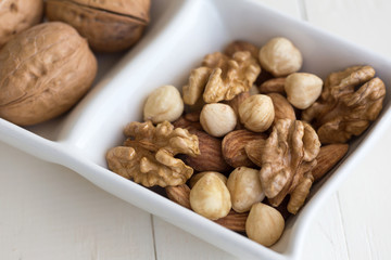 mixed nuts in white dish