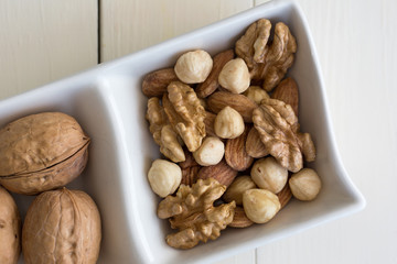 mixed nuts in white dish