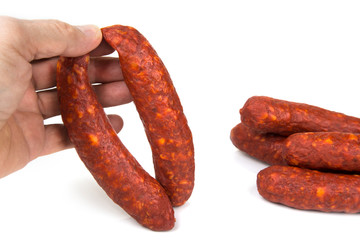 Home made smoked sausages on a white