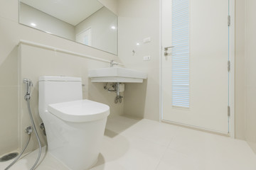 Obraz na płótnie Canvas white toilet clean and simple bathroom