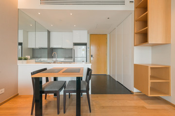 Stylish kitchen interior with dining table and chairs