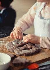 Close up of cookies baking. Little kids hands