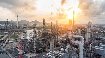 Aerial view of Smart chemical oil refinery plant, power plant and metal pipe at sunrise sky background , Gas and Oil depot.