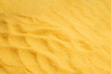 Yellow sand texture and background.