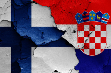 flags of Finland and Croatia painted on cracked wall