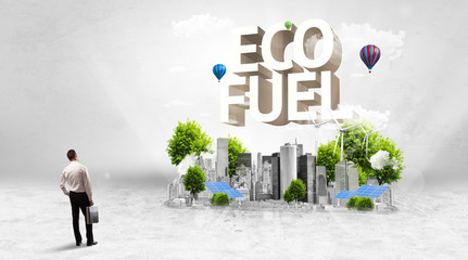 Rear view of a businessman standing in front of ECO FUEL inscription, Environmental protection concept