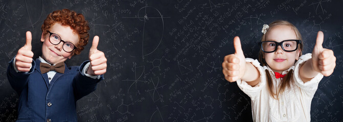 Happy kids student on blackboard background with science and maths formula