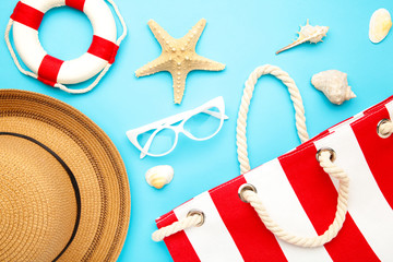 Beach accessories on blue background. Top view