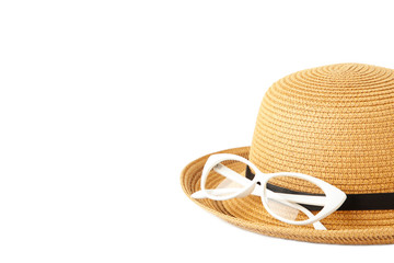 Vintage fabricate straw hat and sunglasses isolated on white background.