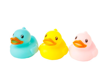 Colorful rubber bath ducks isolated on white background