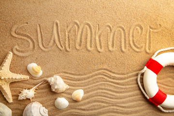 Inscription Summer with seashells on sand background.