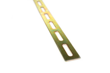 Brass punched perforated bar on a white