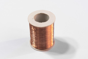 Copper wire spool isolated on a white background