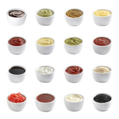 Obraz na płótnie Canvas Set of different delicious sauces and condiments on white background