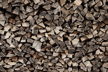 Chipped firewood is neatly stacked.